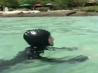 Swimming in the ocean with ebony babe