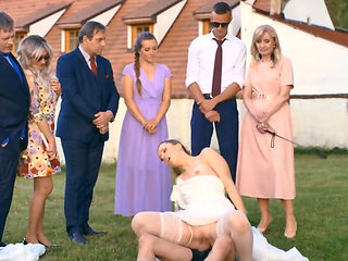 A man in a dog mask is fucking the bride while outside