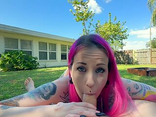 Tattooed temptress sucking cock outdoors