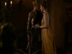 Carice van Houten approaching a guy and letting her robe fall open to reveal her breasts and her butt from the side. Her robe then comes off entirely as she makes out with the guy and he lays her back on a table to have sex with her, Carice's breasts in v