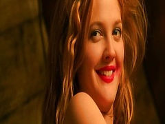 Drew Barrymore in a blue racing suit that is unzipped down the front to show plenty of cleavage as she slips into the passenger seat of a convertible and distracts the driver with her cleavage. From Charlie's Angels.