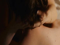Christina Ricci lying on her side on a bed awaiting a guy, her left breast in view and her hair cascading down over her right breast. We then see her having sex with the guy, both her breasts in view. From Bel Ami.