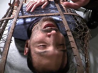 kinky brunette hottie plays with her caged boy toy