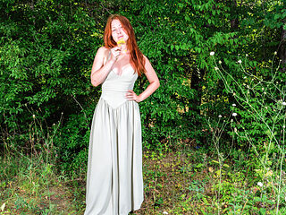 Pale redhead with perfect curves is naked in nature