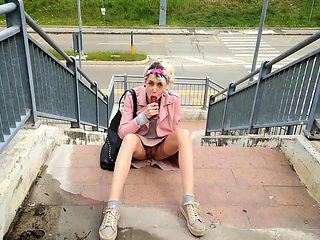 Wild European girl driving herself to climax in public