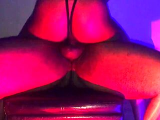 Ebony babe rides a big black dick and moans loudly.