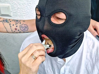 Brunette Dominatrix Nika smokes cigarette on balcony an...