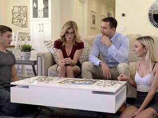 Four sexy babes enjoy a hot foursome on the sofa