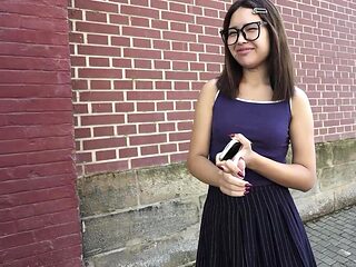 Cute Asian nerdy girl in glasses is picked up for her f...