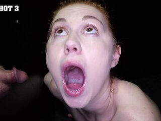 Redhead slut Ellie Murphy sucks through gloryhole