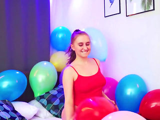 Balloon popping teaser shows her big naturals as well