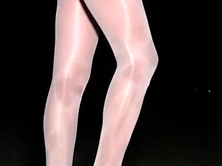 Anna in white shiny pantyhose on the night beach